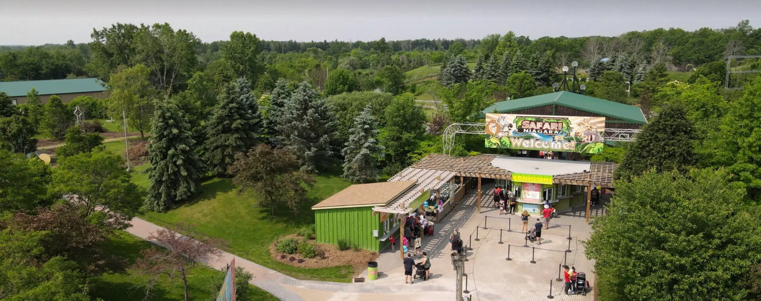 Aerial of Safari Niagara's Entrance with their logo and wooden entrance building