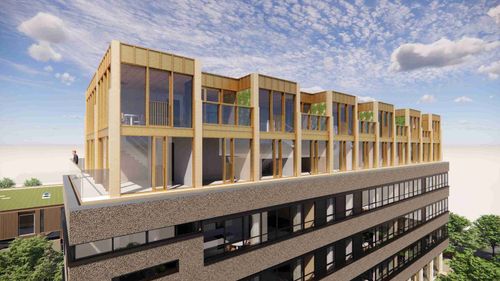 Straatbeeld van een bestaande woonwijk waar door optoppen extra woningen zijn toegevoegd