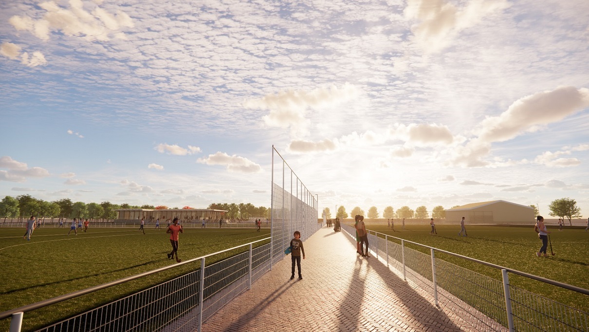 Avondrender van het houten clubhuis Ringpass Delft, sfeervol verlicht en omringd door groen.