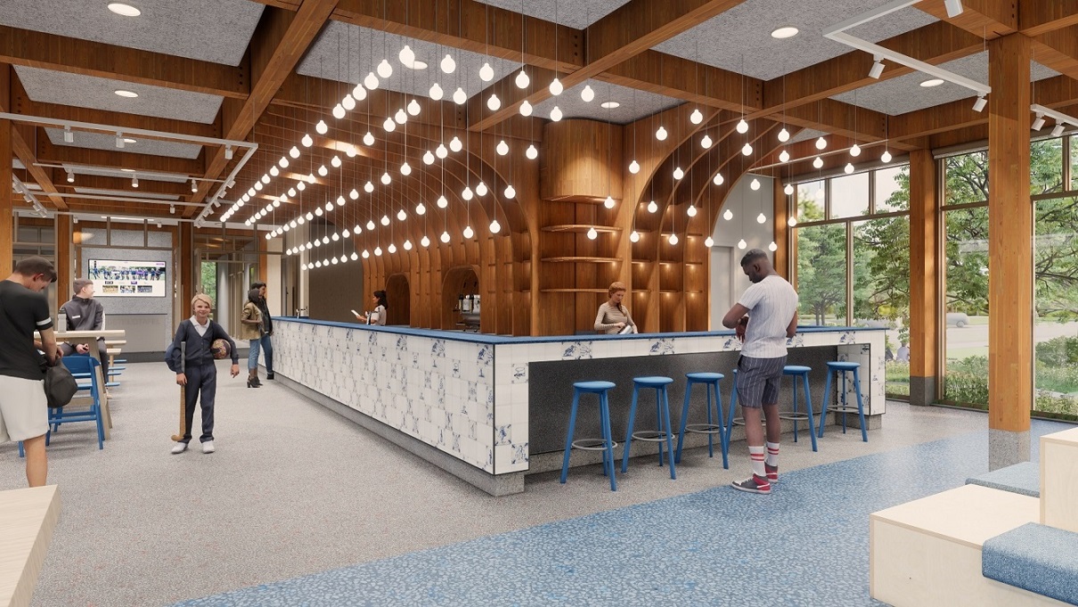 Interieur van het clubhuis Ringpass Delft met zichtbaar houten balken, veel daglicht en natuurlijke materialen voor een warme, open sfeer.