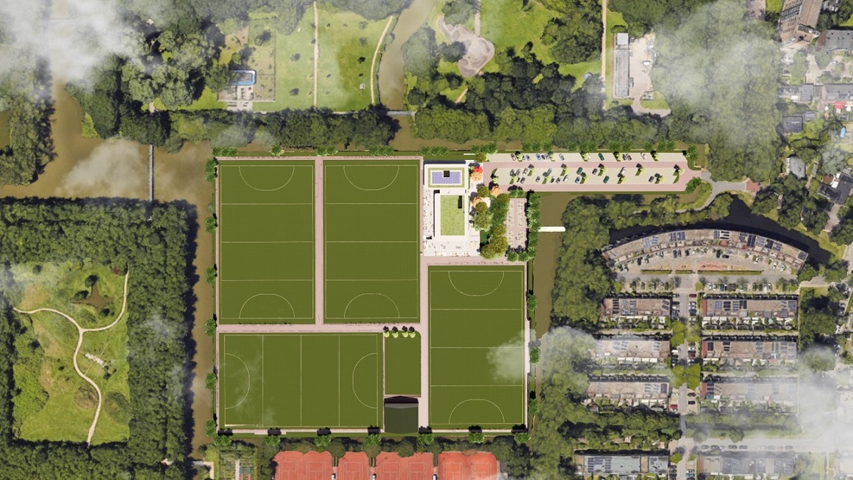 Het nieuwe sportcomplex Ringpass Delft ingebed in een groene omgeving met biodiverse beplanting en zicht op de hockeyvelden.