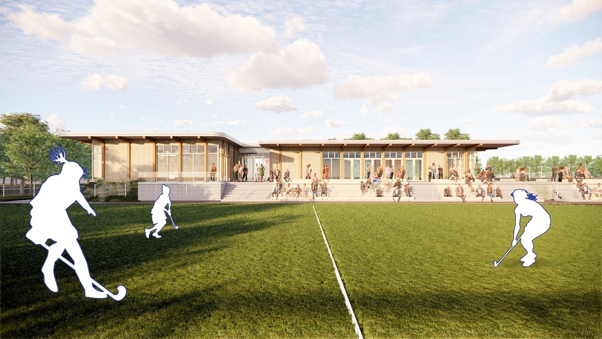 Het nieuwe sportcomplex Ringpass Delft ingebed in een groene omgeving met biodiverse beplanting en zicht op de hockeyvelden.