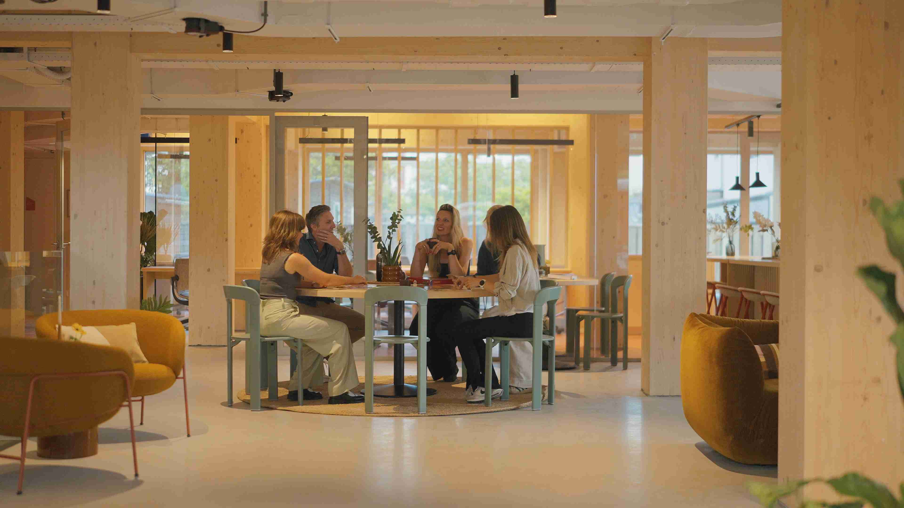 Shared workspace at The Urban Woods Delft where residents work, connect and collaborate within a sustainable community..