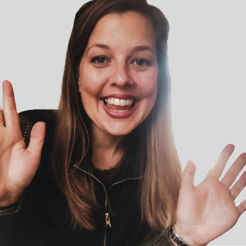 Professional headshot of female therapist Nikolai Blinow with strawberry blond braided hair wearing yoga attire.