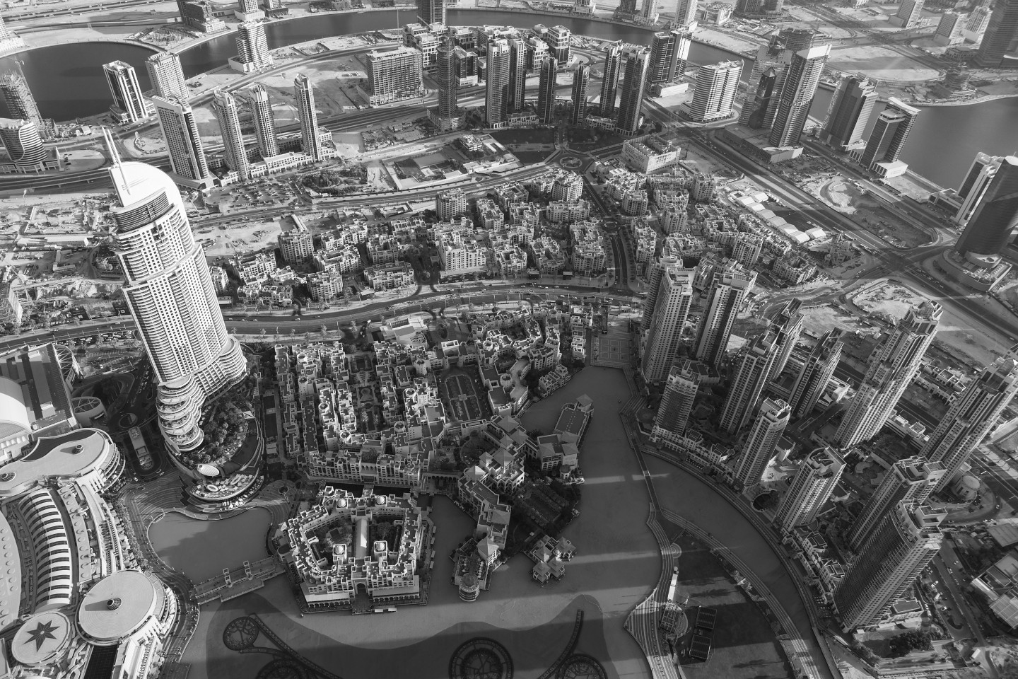 A black and white photo of an aerial view of a city.