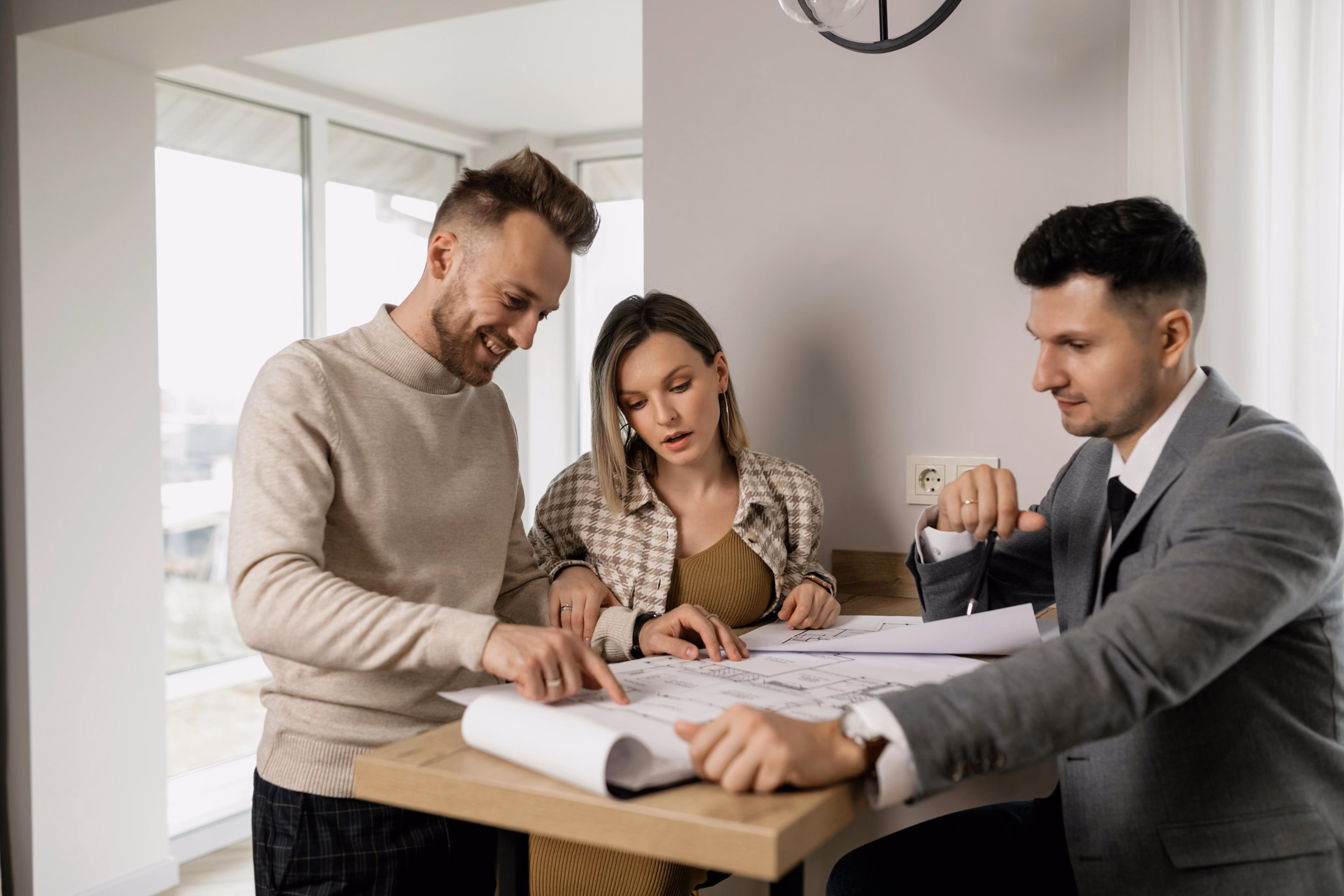 Property owners meeting with a local property management advisor