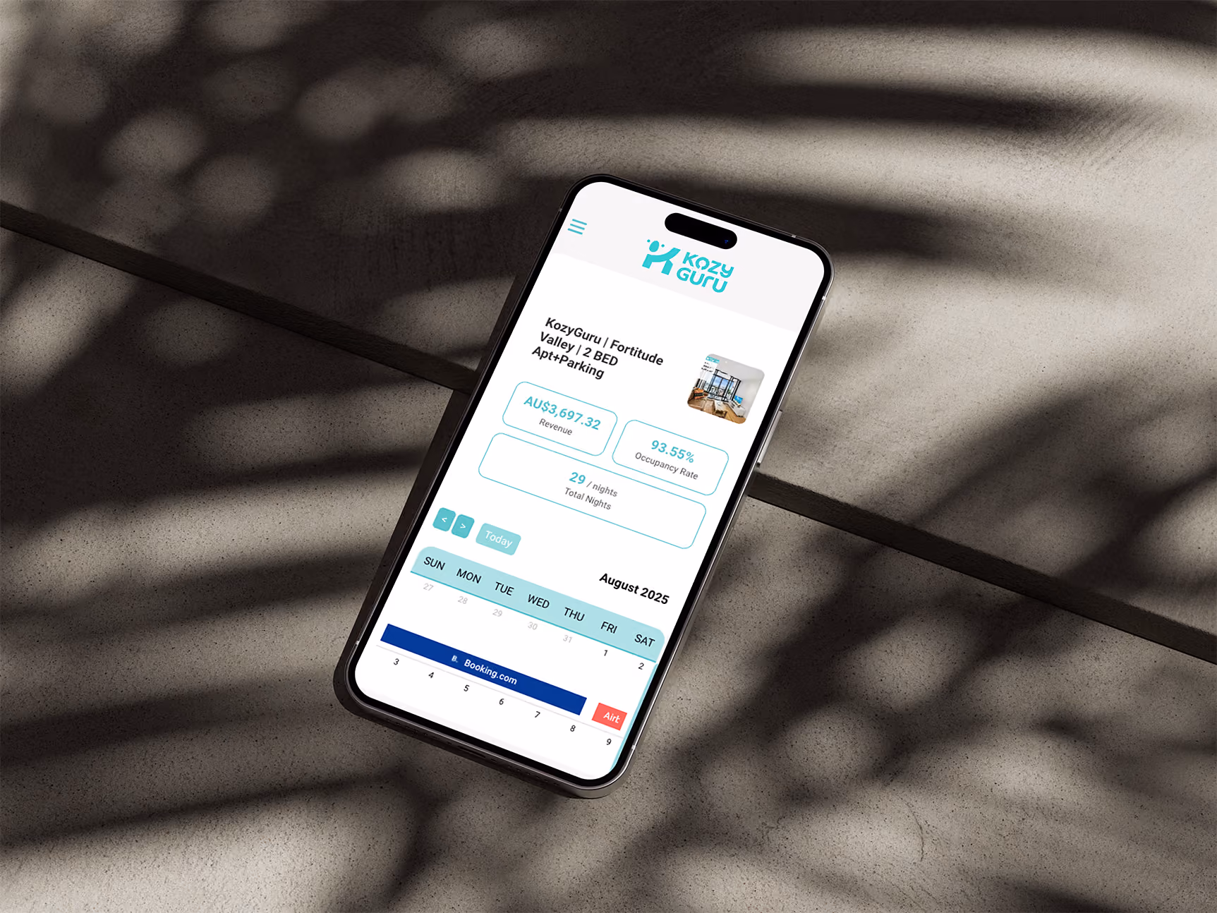 KozyGuru owner portal displayed on a smartphone