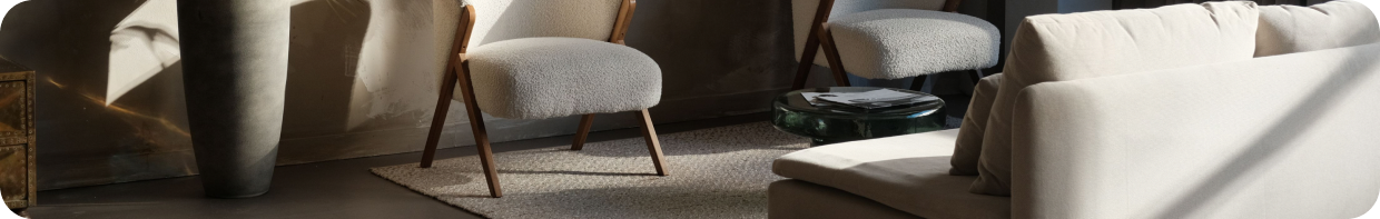 Styled short-stay rental interior with seating and sunlight