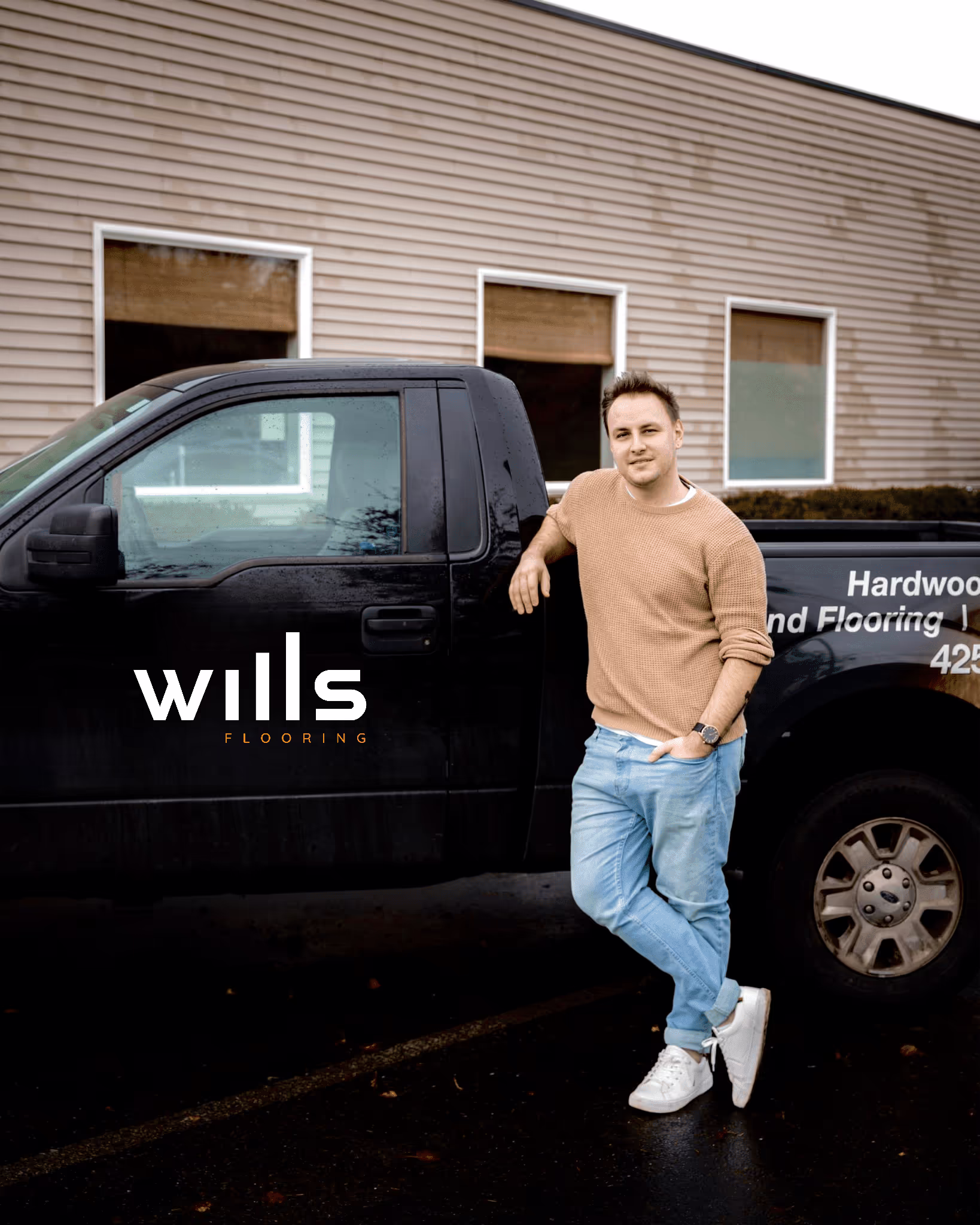 Andrew from Wills Flooring next to the company truck in Everett, WA