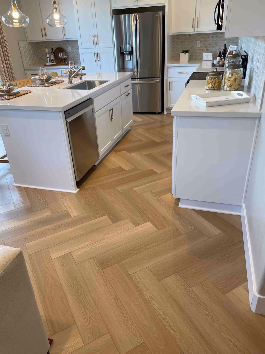 Herringbone flooring installation in a kitchen