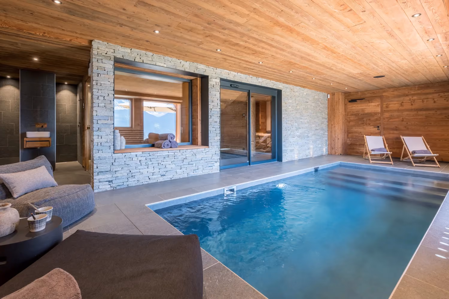Indoor heated swimming pool and wellness area in a luxury chalet in Megève.