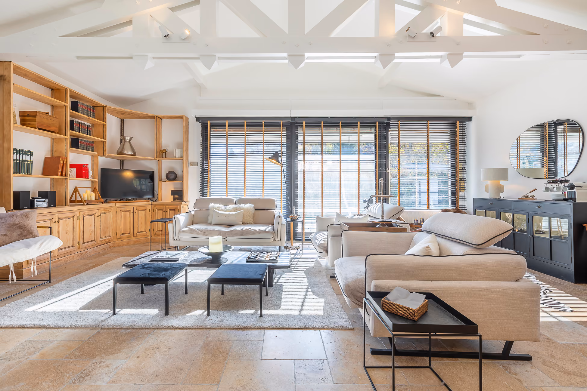 Contemporary living room with large picture windows in a luxury chalet in Saint-Gervais-Mont-Blanc.