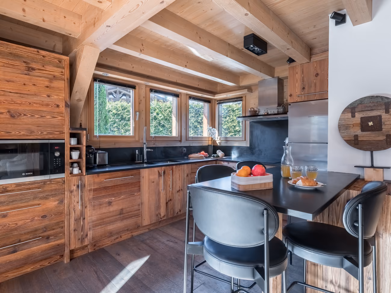 Fully equipped kitchen with breakfast bar opening onto the chalet's living area