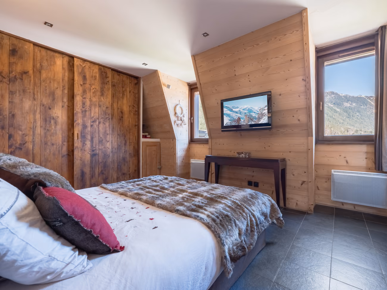 Comfortable double bedroom with mountain views