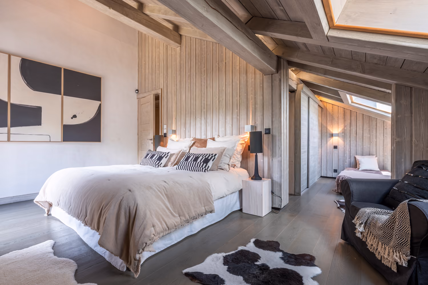 Spacious family bedroom with children's sleeping area at Chalet Mozart, luxury chalet in Megève.