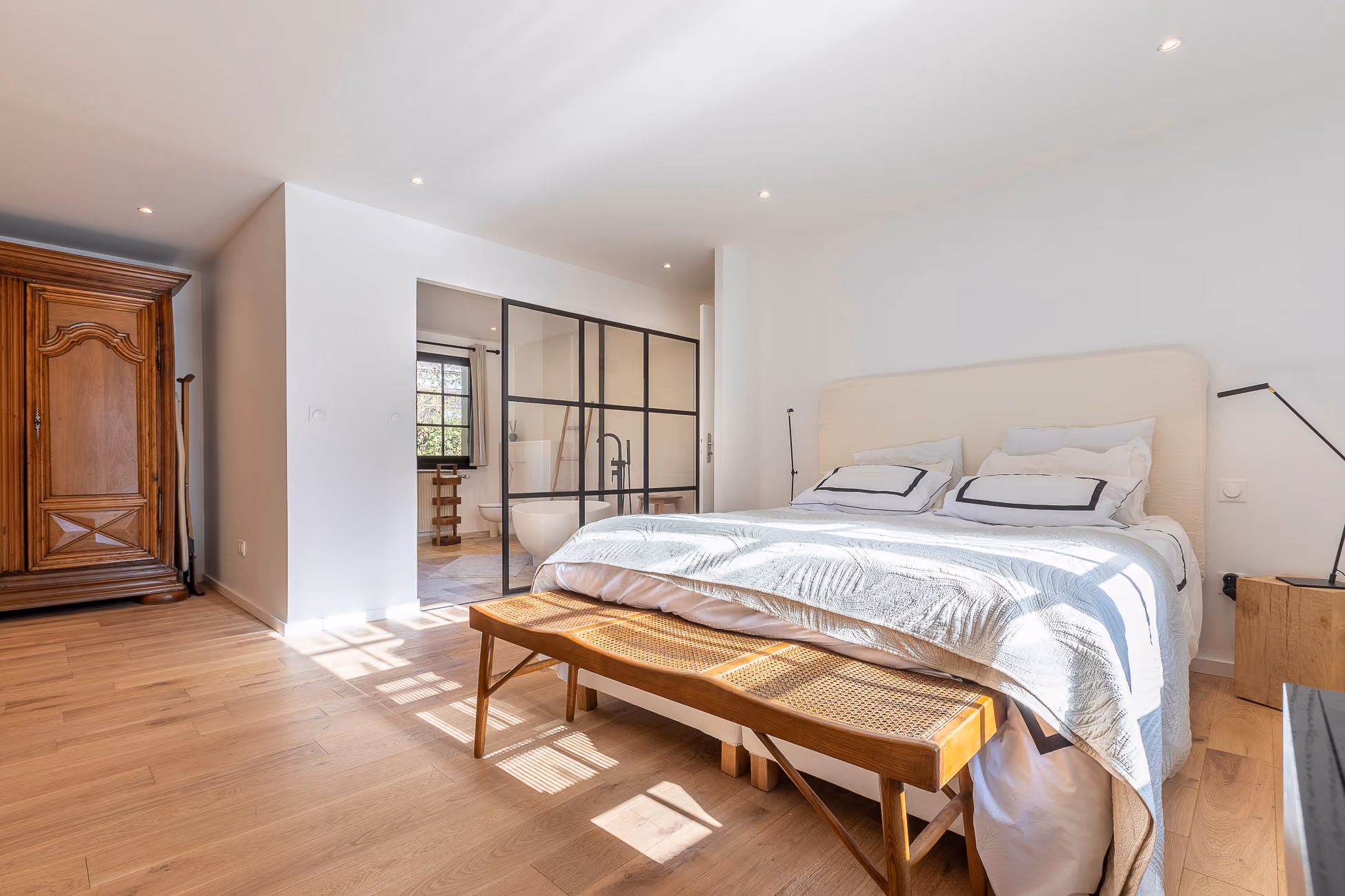 Master suite with open bathroom at Chalet Soleil Blanc in Saint-Gervais-Mont-Blanc.