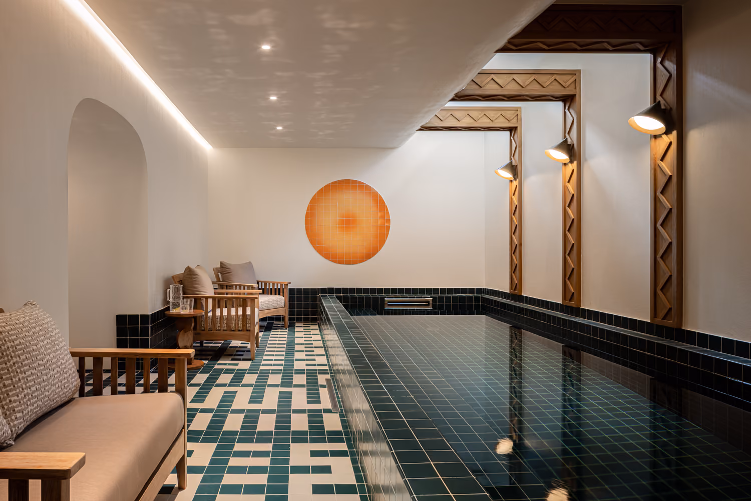 Heated indoor swimming pool with relaxation area in a luxury chalet in Megève.