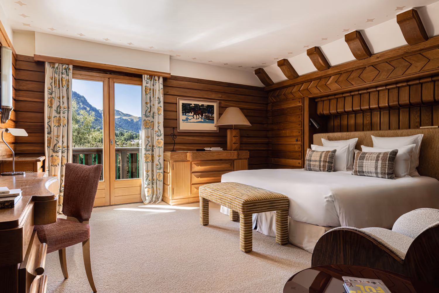 Elegant suite with private balcony and mountain views in a luxury chalet in Megève.