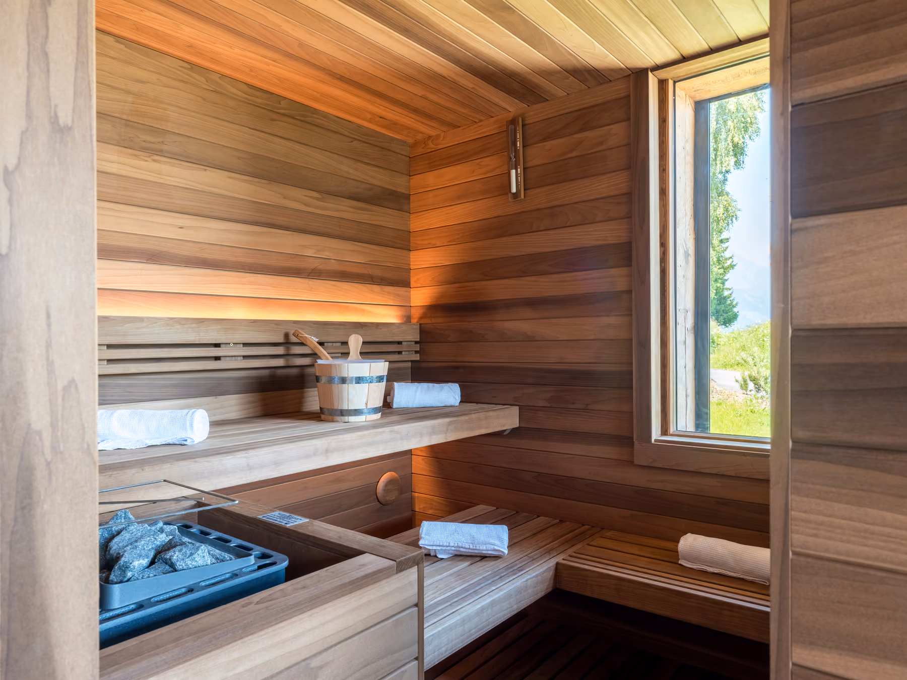 Private wooden sauna with nature views in the wellness area of Chalet Victory.