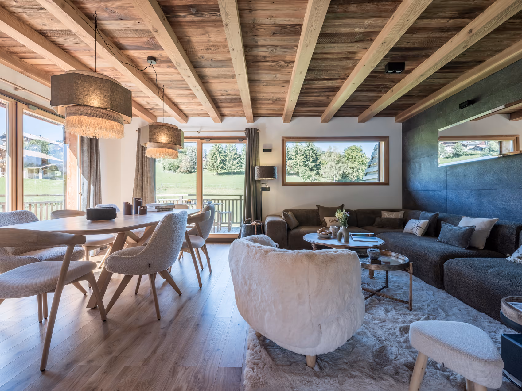 Bright and inviting dining area filled with natural light at Chalet Zazen in Combloux.
