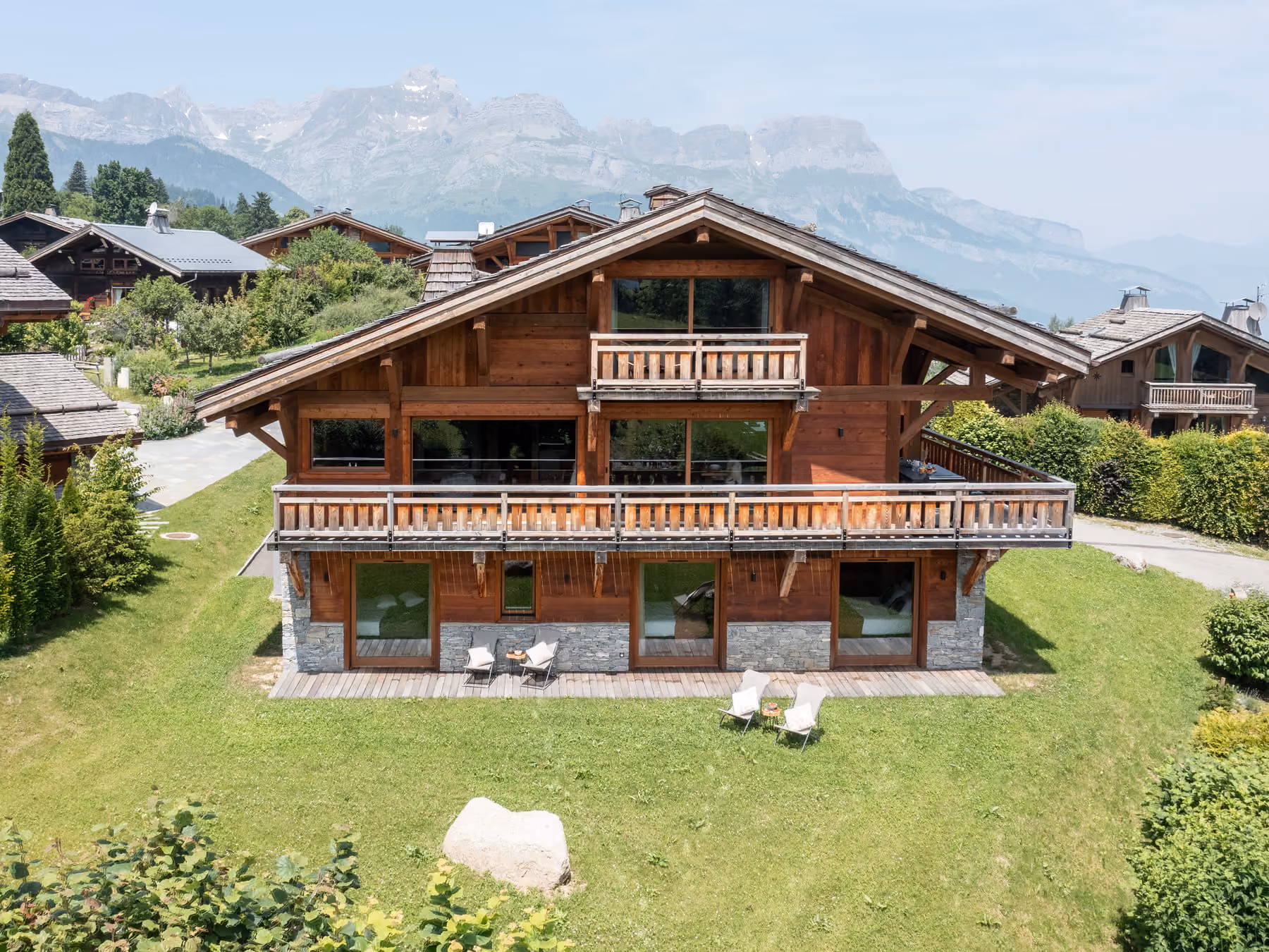 Aerial view of Chalet Double M with private garden and mountain scenery in Combloux.