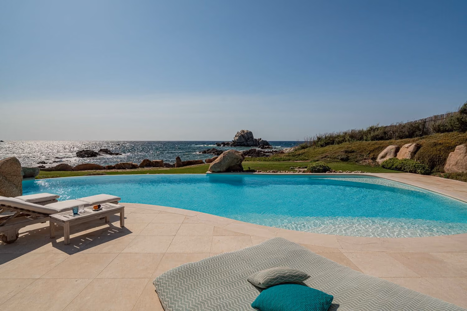 Private swimming pool overlooking the Mediterranean Sea in a luxury villa in Sardinia.