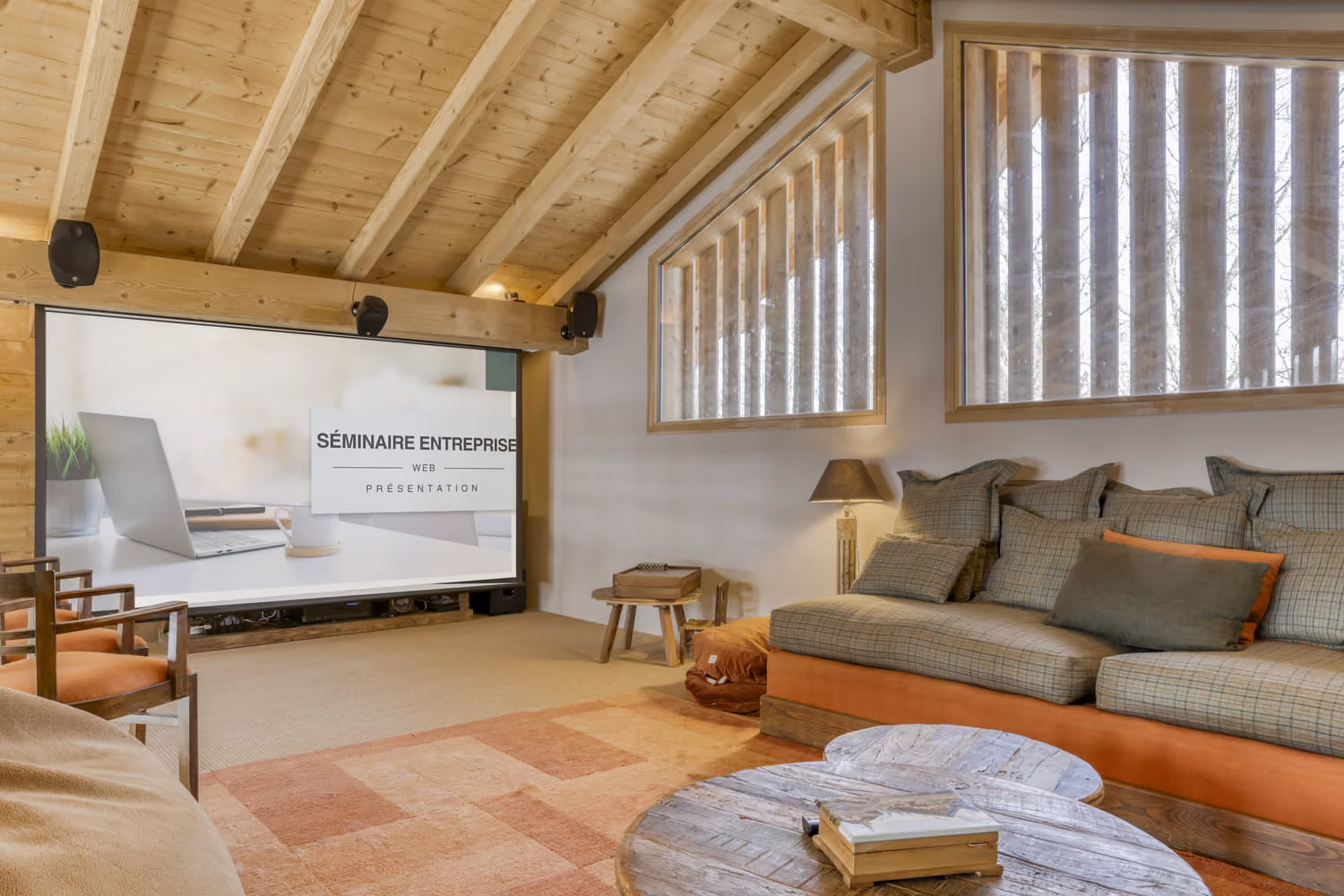 Private cinema room with oversized sofas for relaxing family and friends' movie nights