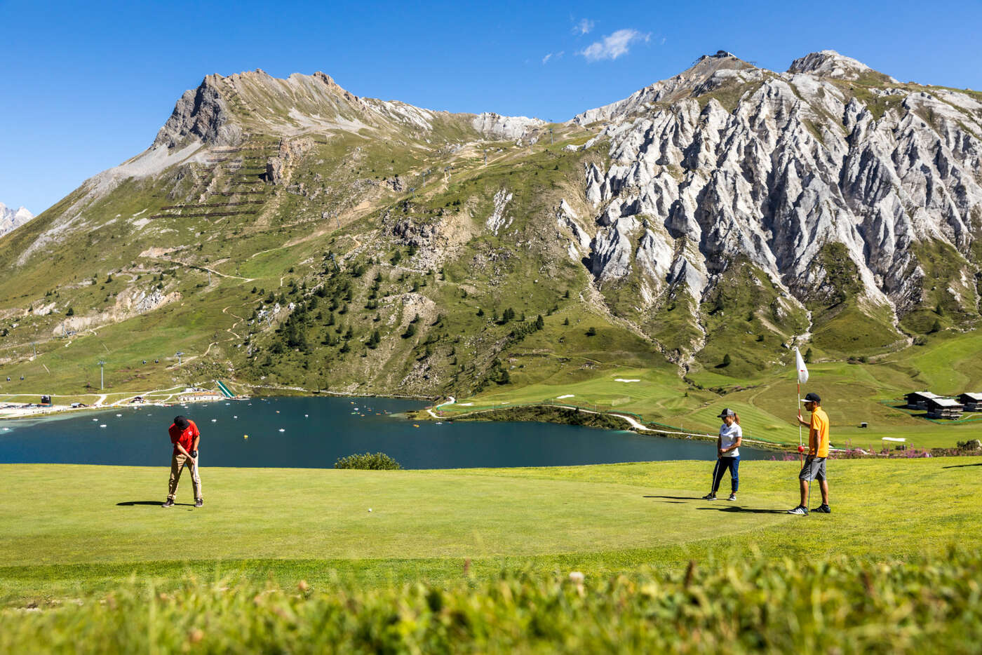 Tignes Golf Course overlooking Lake Tignes and the spectacular mountain scenery of the French Alps during summer.