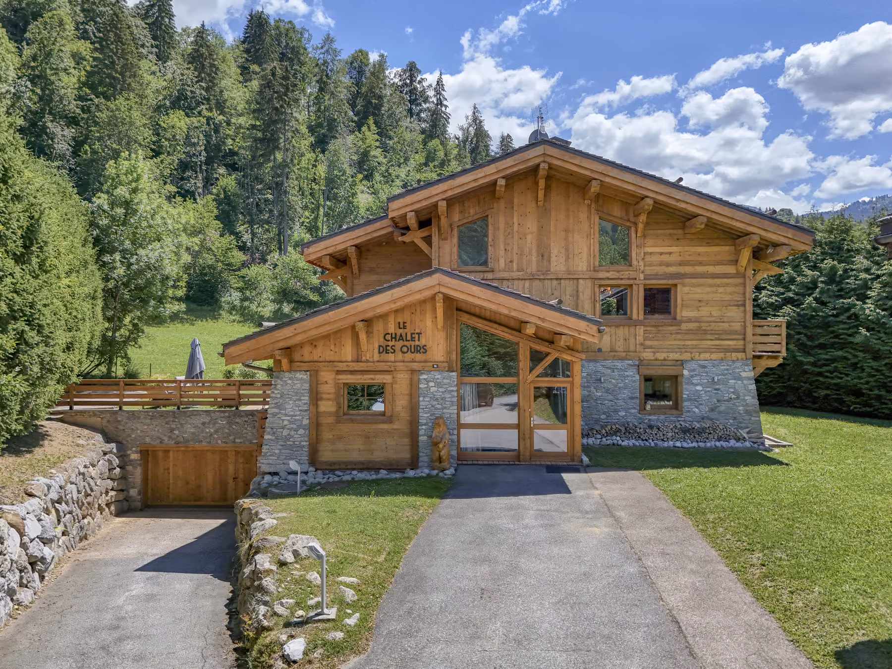 Exterior of Chalet des Ours, luxury chalet in Megève with landscaped garden and spacious outdoor areas.