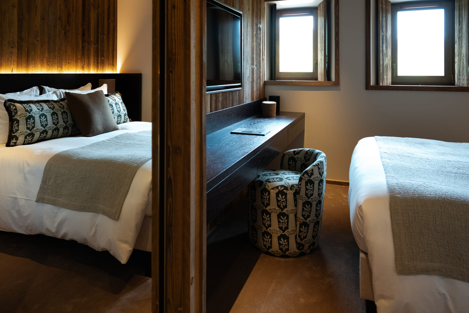 Elegant bedroom in a luxury chalet in Megève with a dedicated workspace.