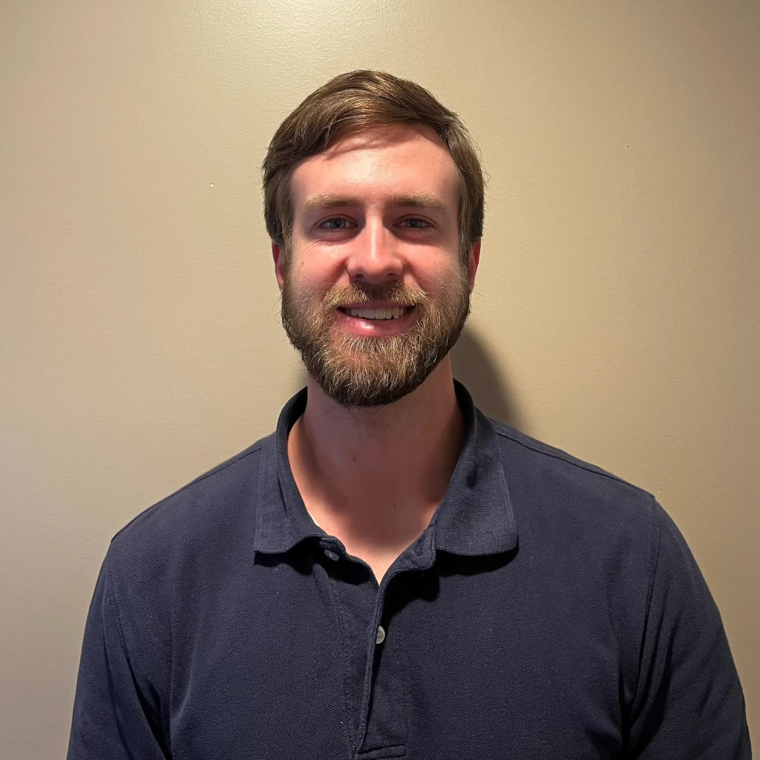 Occupational therapist guiding a patient through hand therapy exercises in a clinical setting, focusing on restoring strength and daily function.