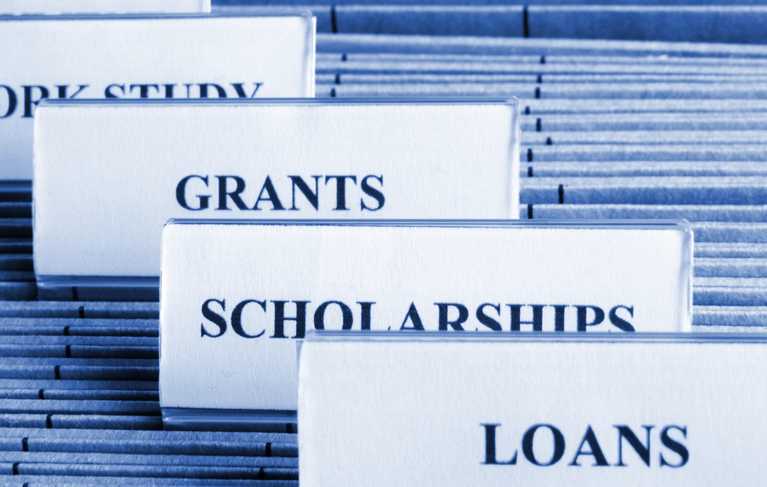 File folders labeled work study, grants, scholarships, and loans, representing different ways to fund occupational therapy school.