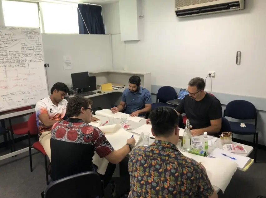 Language Champions and Elders at a translation workshop