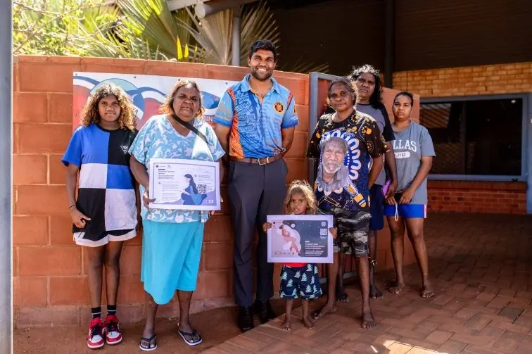 Community members and the Lyfe Languages team holding newly launched health resources