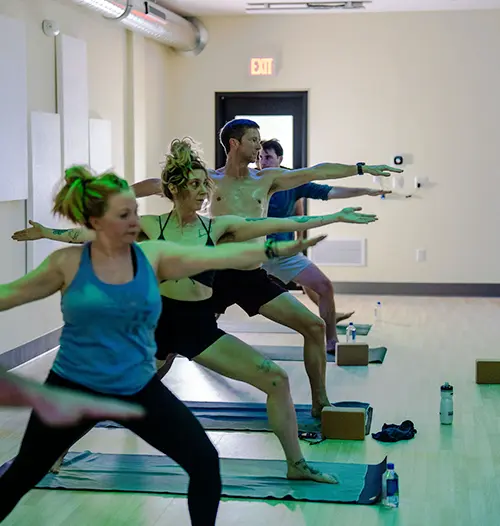 Man Practicing Hot Yoga at Helios yoga studio