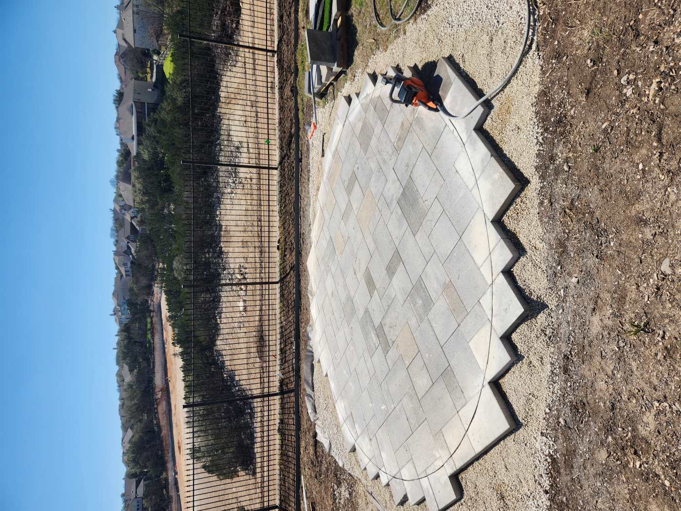 A custom cut paver fire pit area in Stone Oak TX