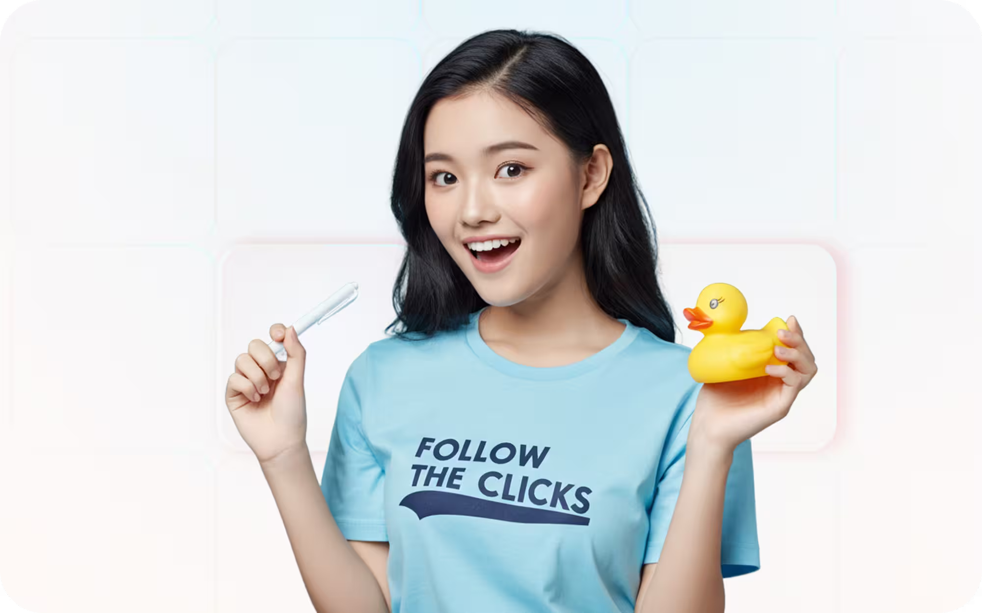 A woman in a blue shirt holds a toothbrush and a yellow rubber duck, smiling.