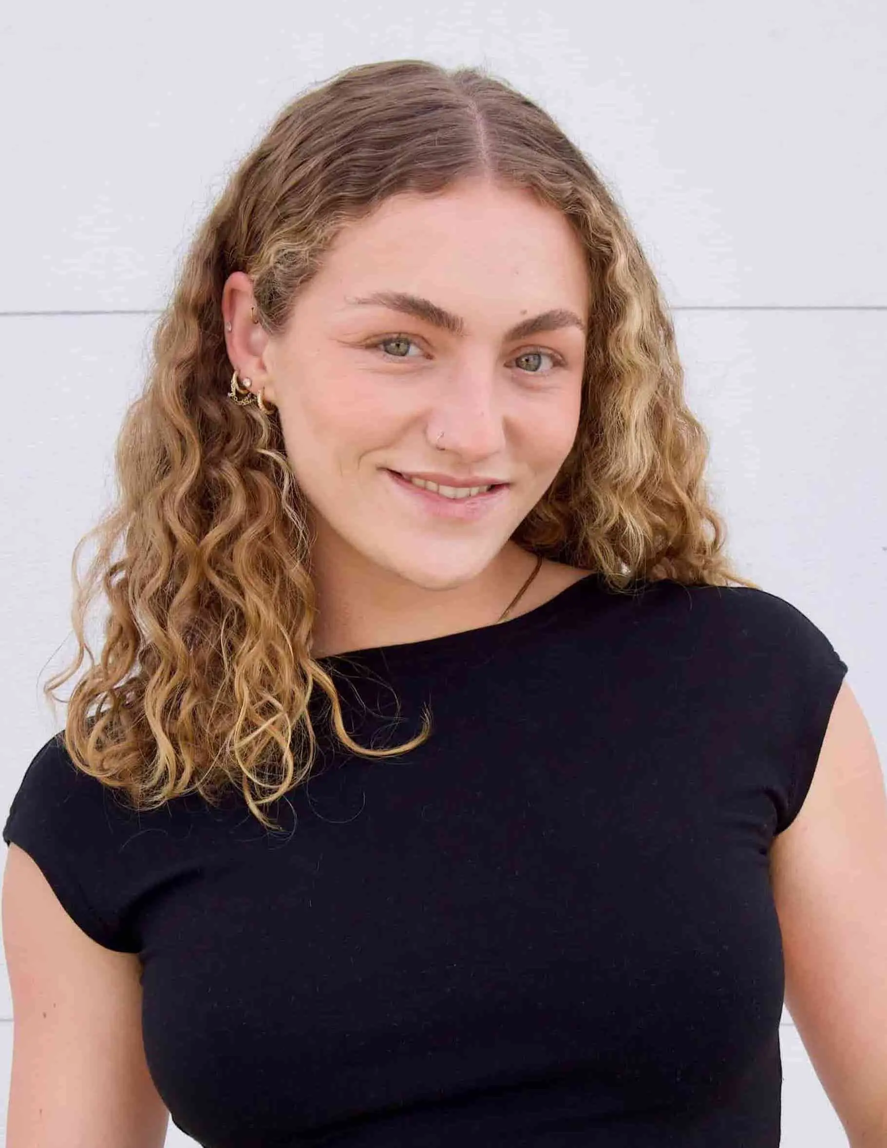 A professional female web designer working with brands in Southern California.
