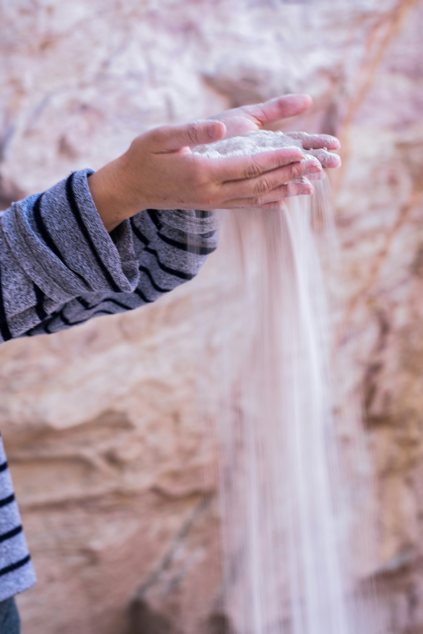 A climber's hands holding climbing chalk