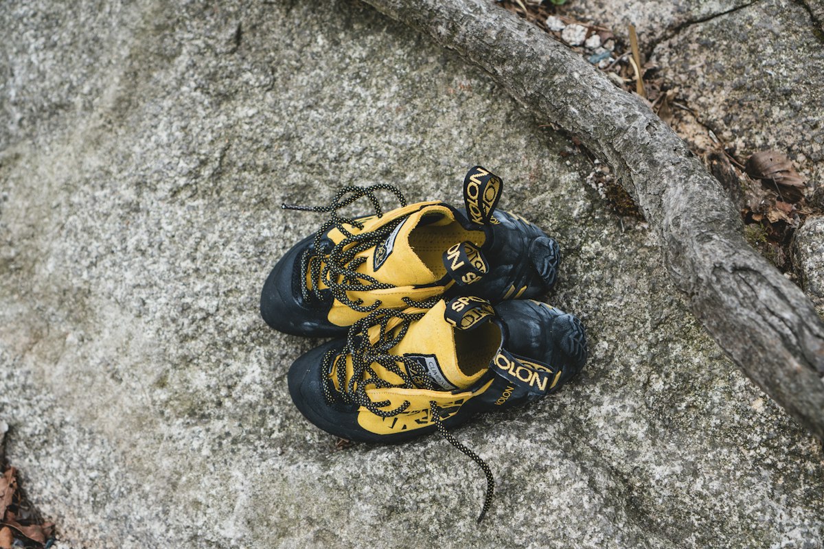 Yellow and black climbing shoes
