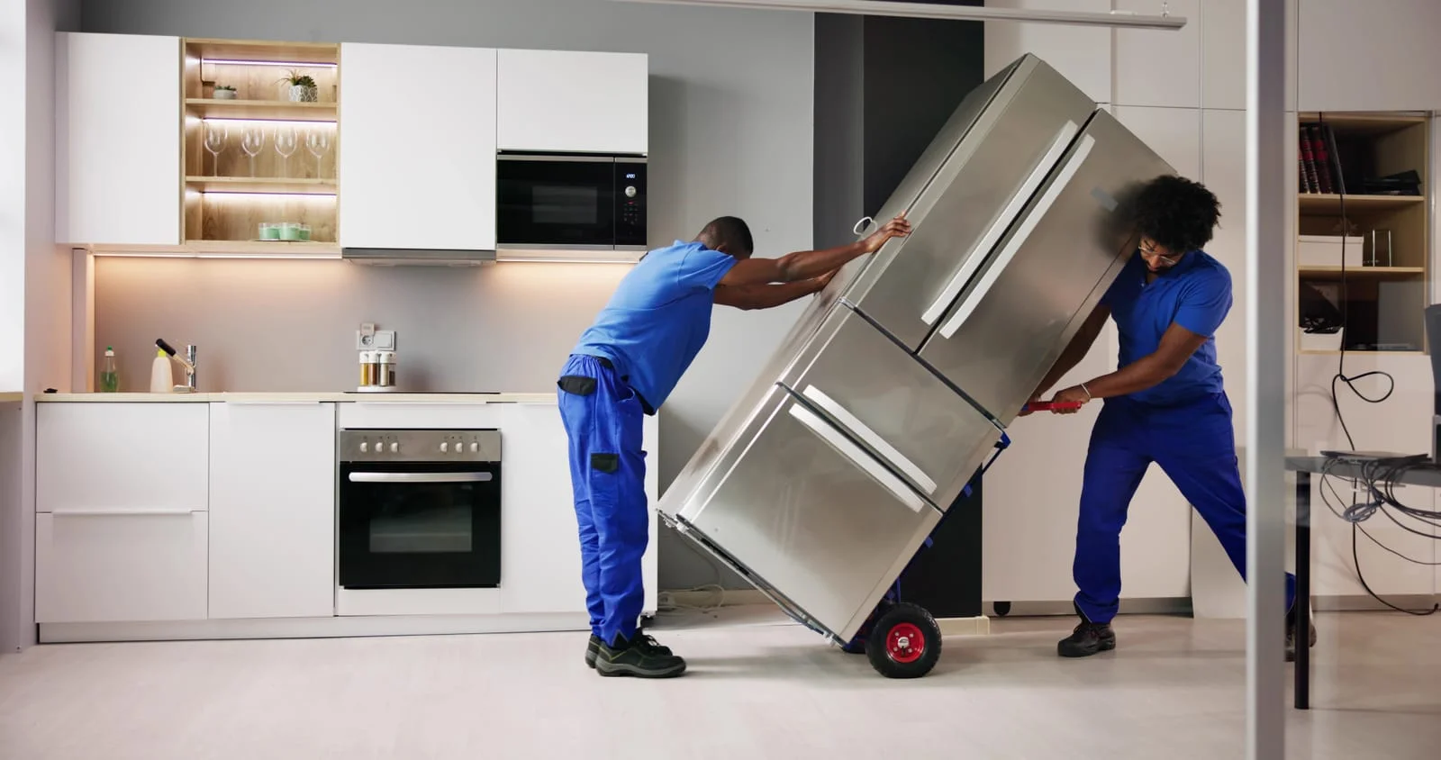 professional movers packing appliances for moving