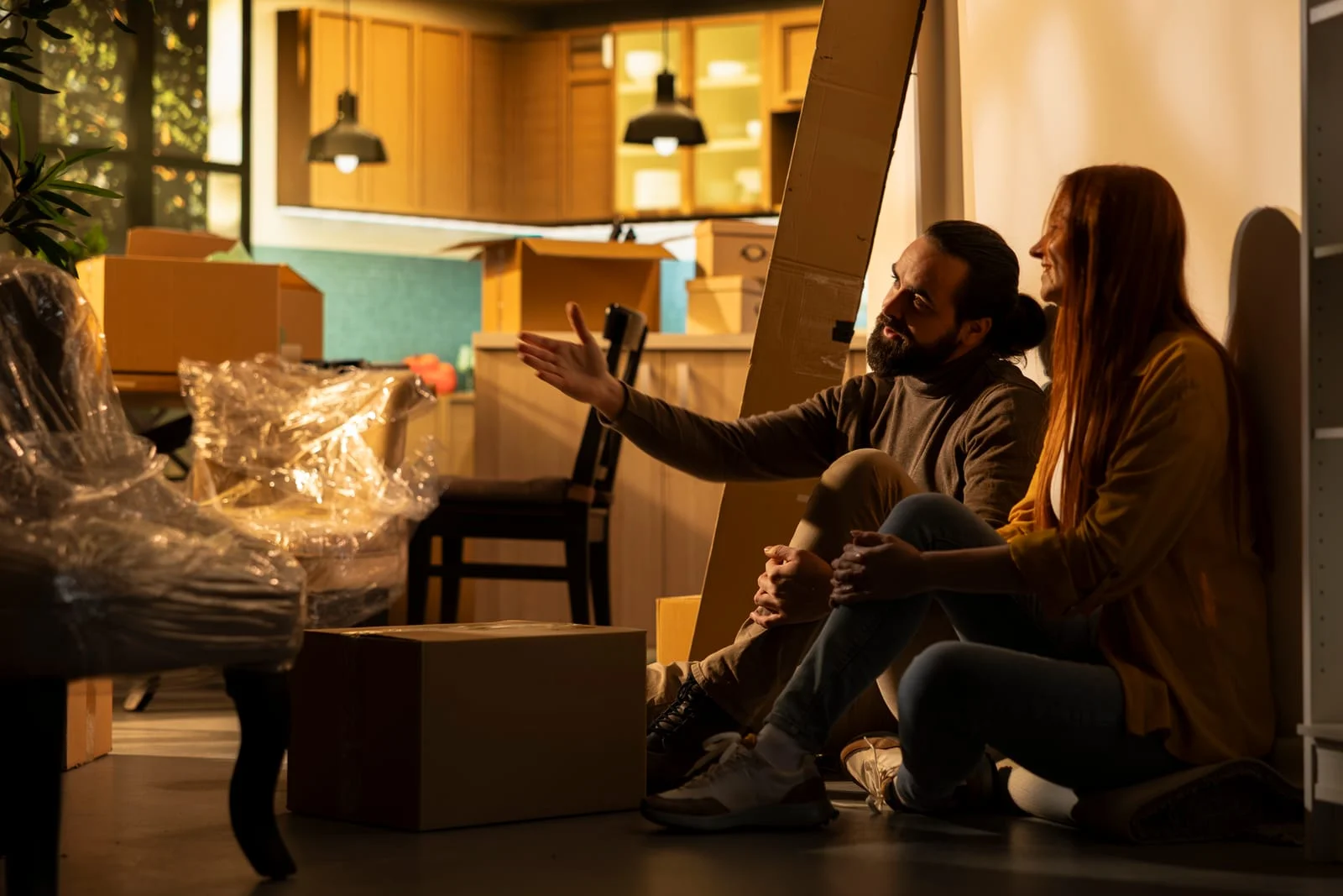 couple discussing how to start packing to move