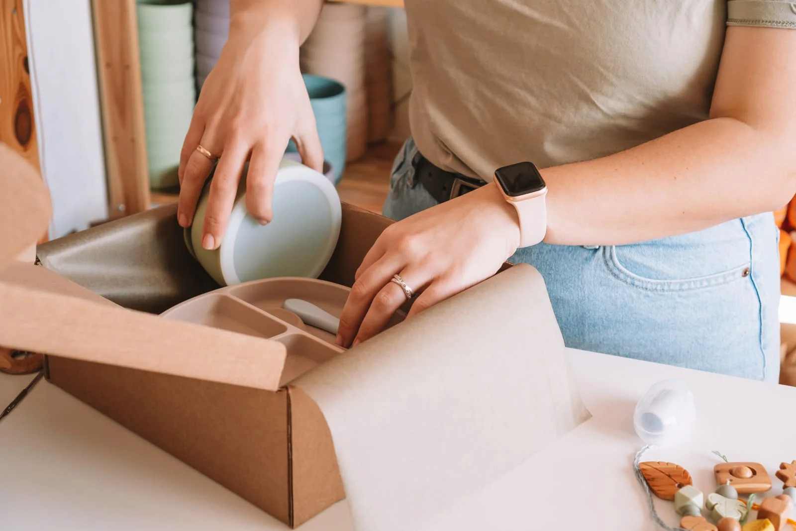 woman packing dishes for moving