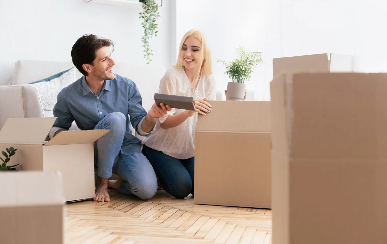 couple is packing boxes preparing to move out of state