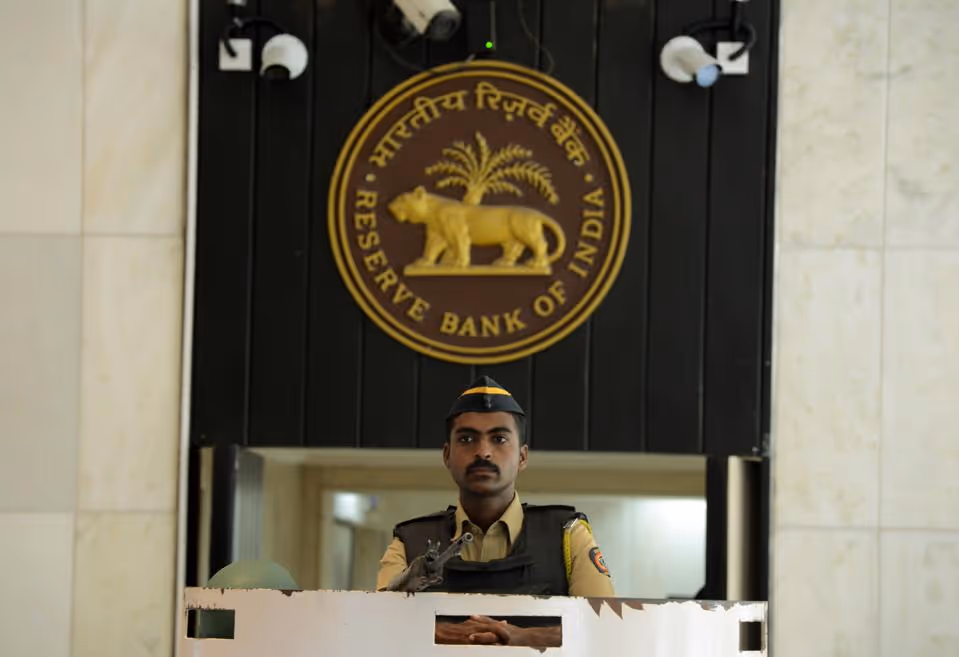 An Indian policeman stands guard inside the Reserve Bank of India head office in Mumbai on August 2,... [+] 2017. (Photo by PUNIT PARANJPE/AFP/Getty Images)