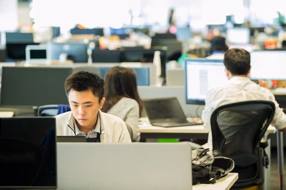 Employees work at the Garena Interactive Holding Ltd. headquarters in Singapore (Nicky... [+] Loh/Bloomberg)
