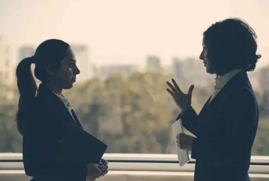 Two women discussing a topic