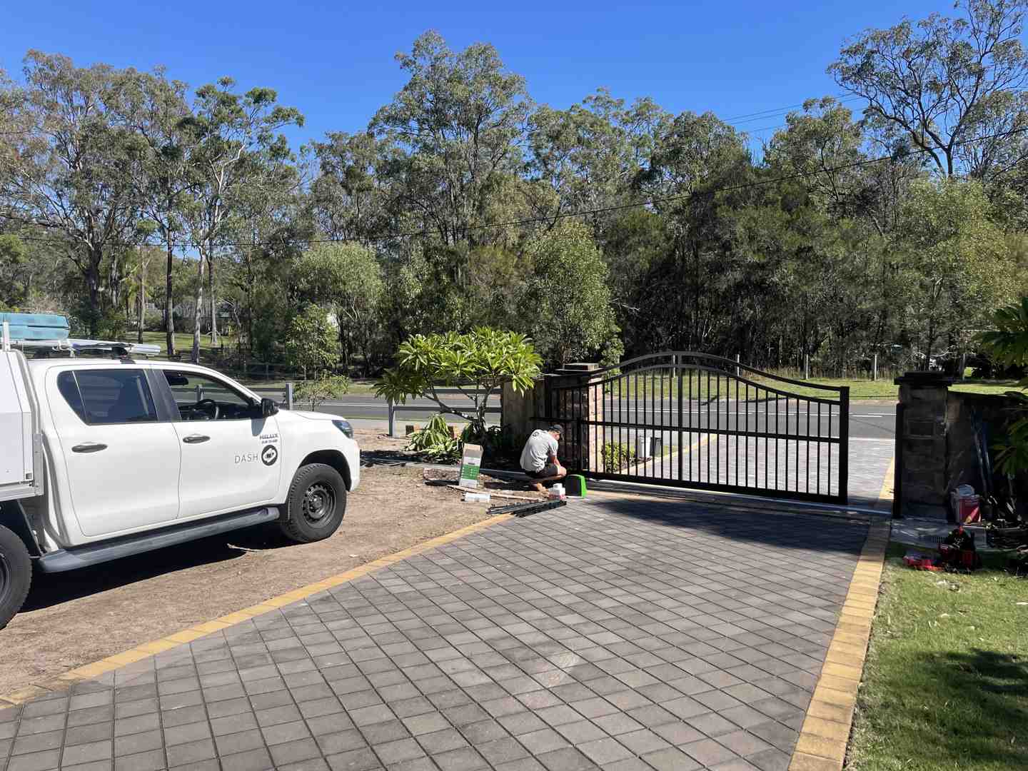 Technician performing maintenance on a gate roller - gate with rollers Technician performing maintenance on a gate roller - gate with rollers