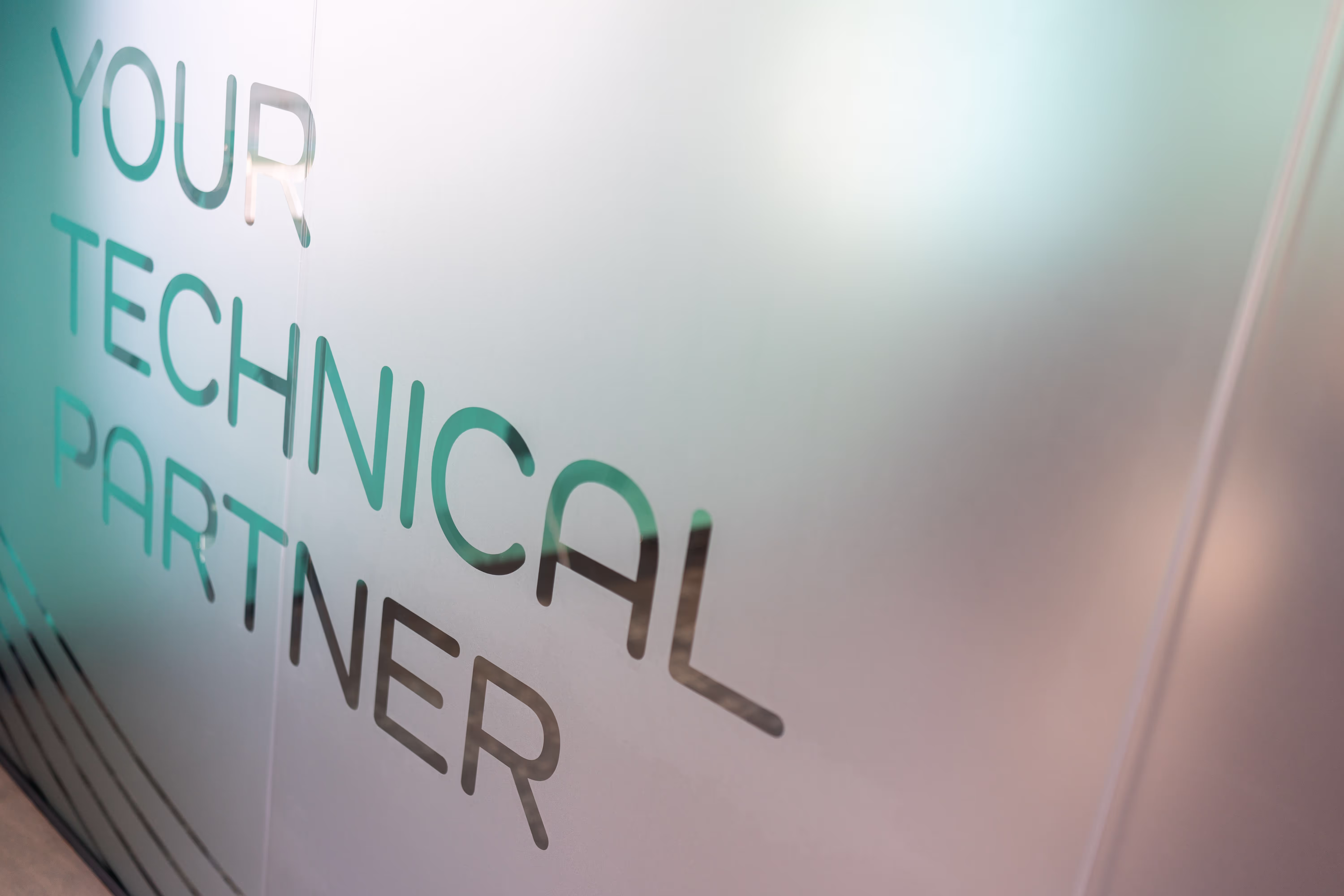 A photo of the motto in the intellicore office, text reads: Your technical partner