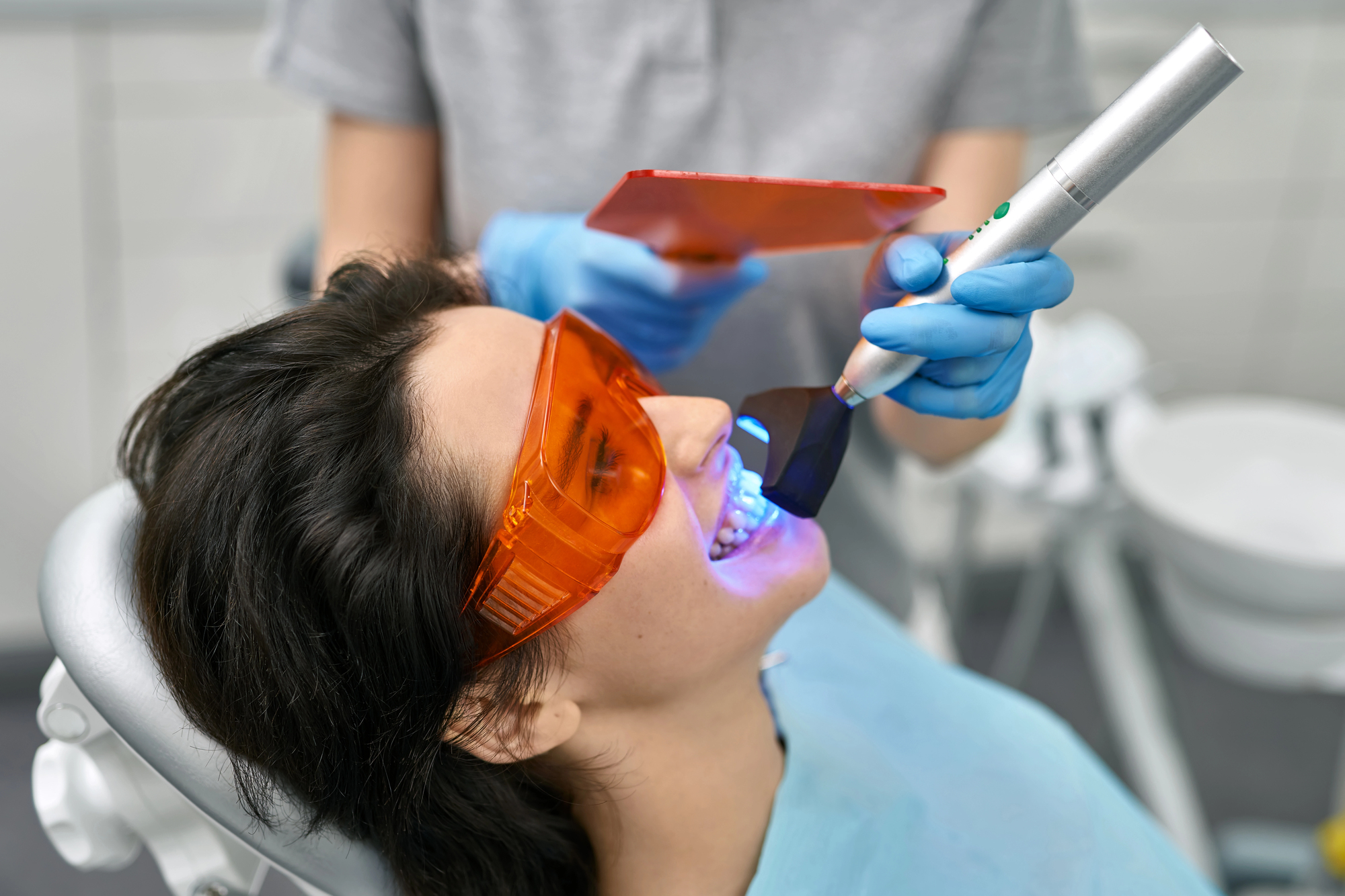 woman getting teeth whitening waxhaw